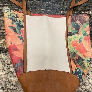 Fun European leather tote measuring 14” tall w/o handles and 17” wide when flat